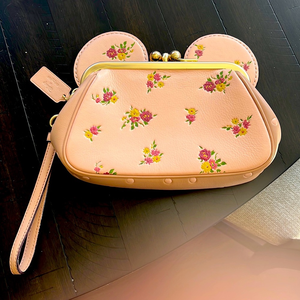 It is a light pink color with floral pattern